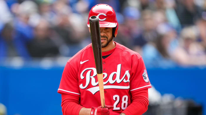 Reds left fielder Tommy Pham (29) bats against the Blue Jays.